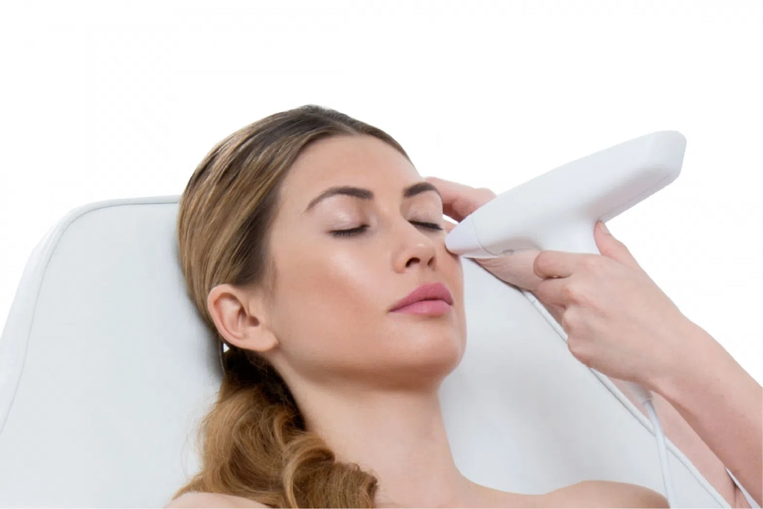 A woman receiving a facial cosmetic  treatment.