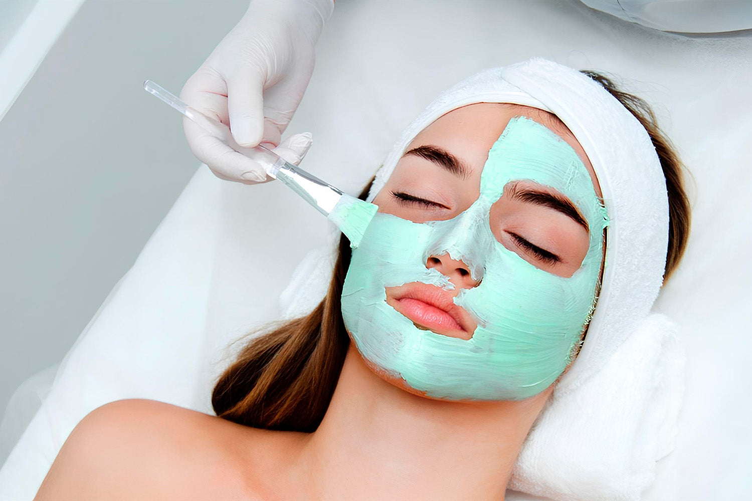 A woman receiving a facial. 