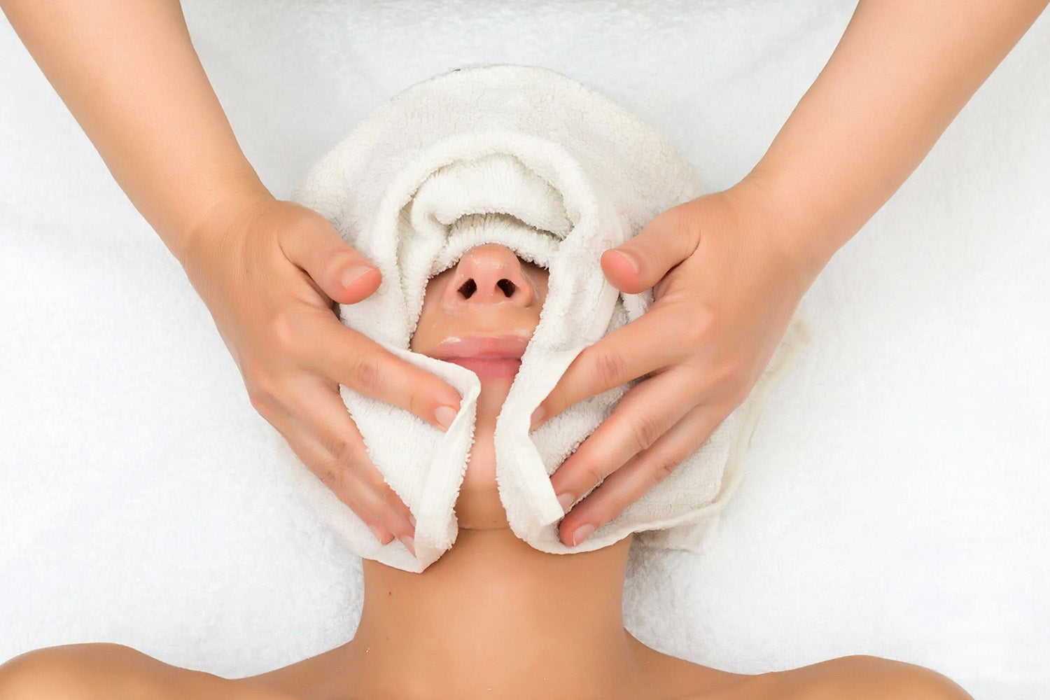 A woman receiving a facial.