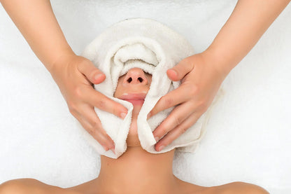 A woman receiving a facial.