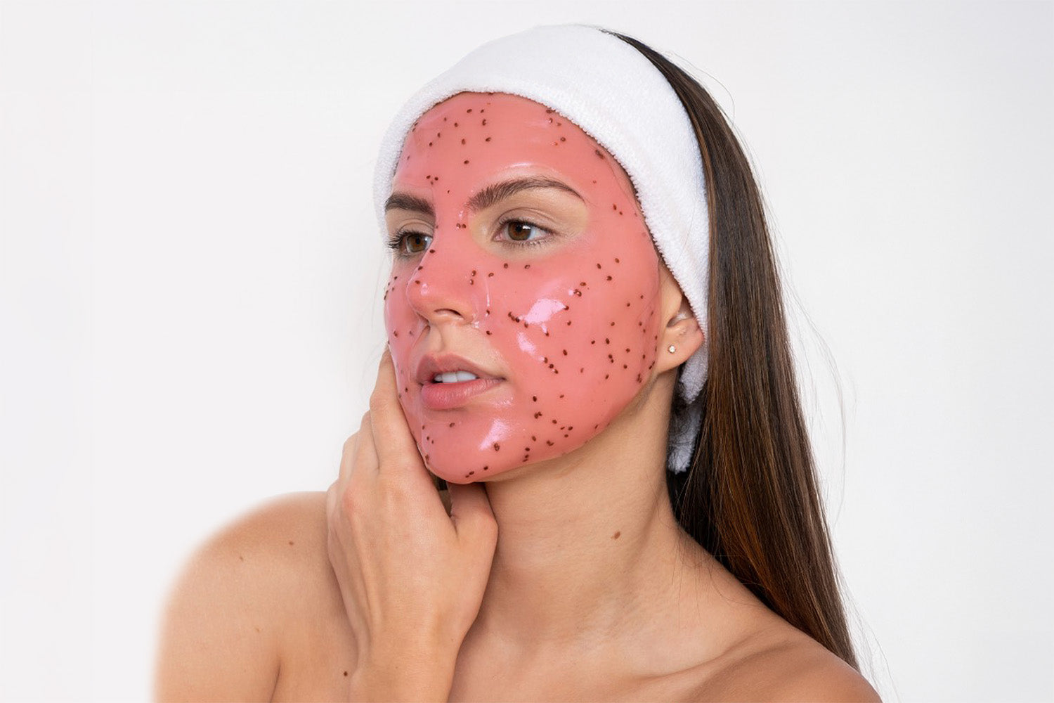 Close up of the face of a woman recieving a Pink Antioxidant Facial.