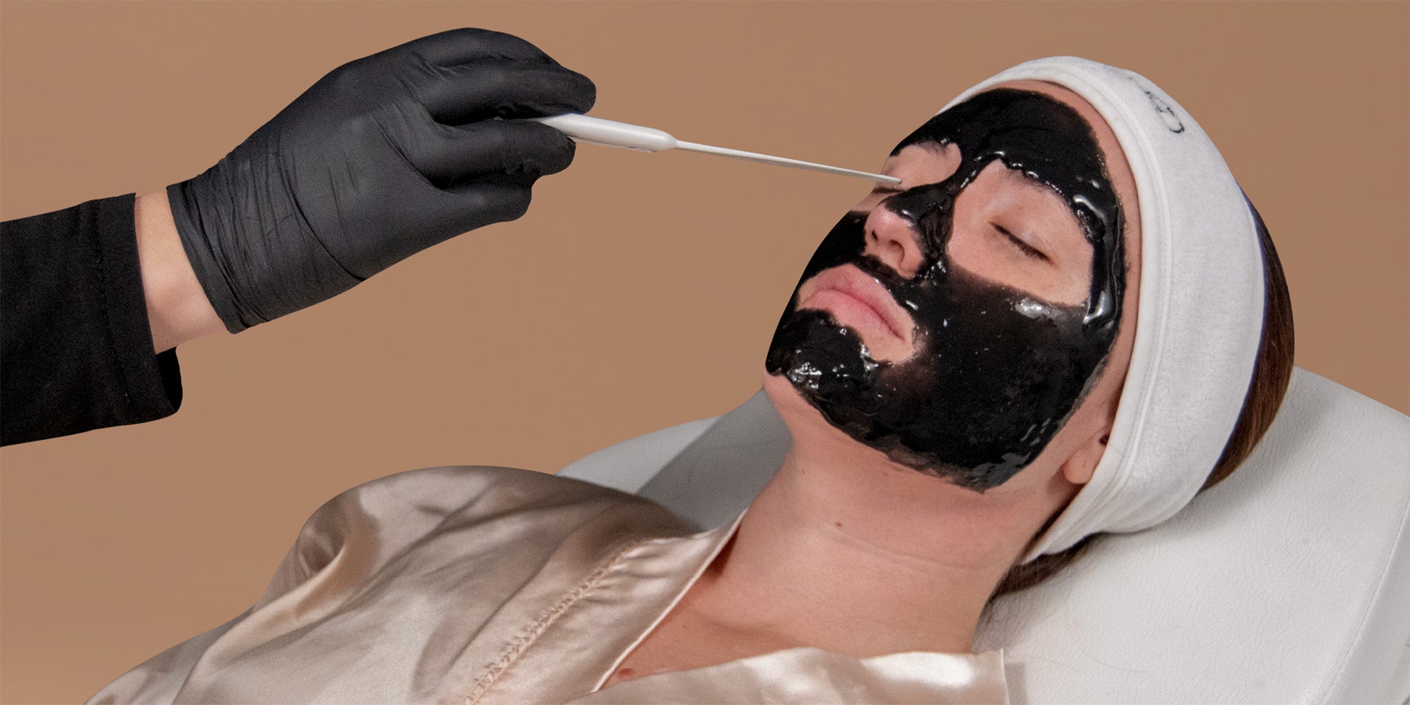 A woman receiving a facial.