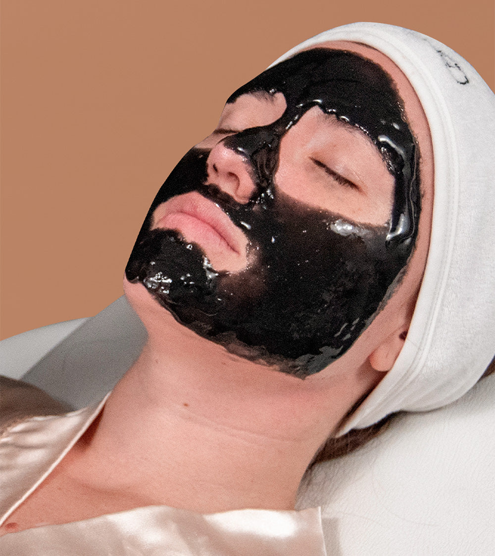 A woman receiving a facial.