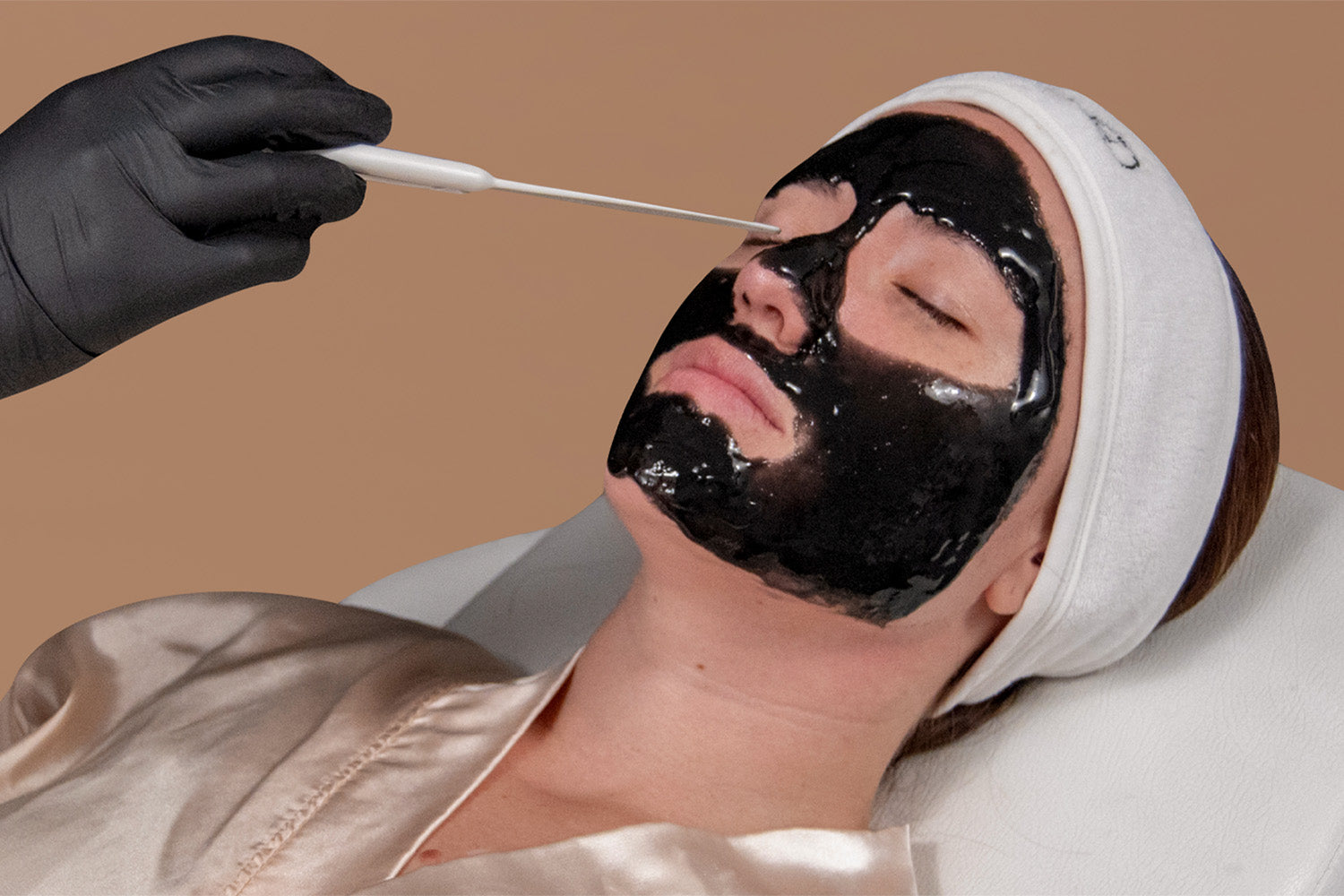 A woman receiving a facial.